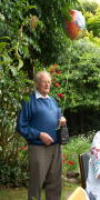 The birthday boy, with balloon in hand.