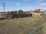 Looking along the goods platform to some of the wagons. Across the road, the local architecture also suggests a railway heritage.