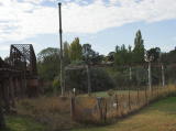 To the east of the bridge, what looks like a tank and water pipe, presumably for steam engines to refill from the Yass river.